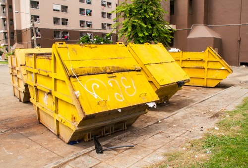 Construction site with waste being cleared in Queens Park