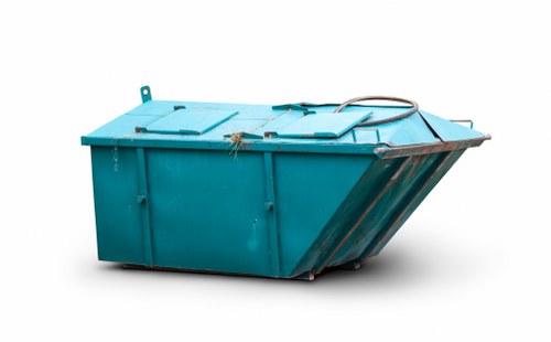 A large, industrial outdoor waste skip with a rectangular shape, painted in bright turquoise, featuring a sturdy metal construction and smooth, flat surfaces. The skip is positioned on a paved area, potentially a driveway or yard, with visible hinges and handles on the top lids designed for secure closure. It appears to be emptied or awaiting loading, with some minor scratches and signs of use on its surface. The background is plain and neutral, emphasizing the skip's metallic finish. A black hose or cable is draped over one corner of the skip, suggesting recent or ongoing waste management activity. The surrounding environment is minimal and does not include other objects or context clues, aligning with typical commercial waste removal scenarios often encountered in urban or suburban areas, such as Queens Park or nearby London neighborhoods. The image exemplifies equipment used by companies like Commercial Waste Removal Queens Park for effective rubbish collection and disposal services.