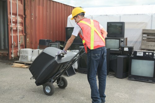 Professional team conducting loft clearance in Queens Park