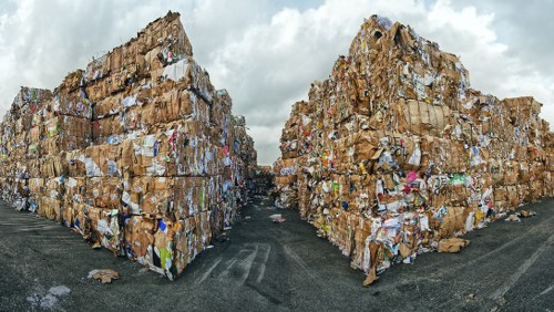 Workers sorting recyclables at a commercial waste collection point